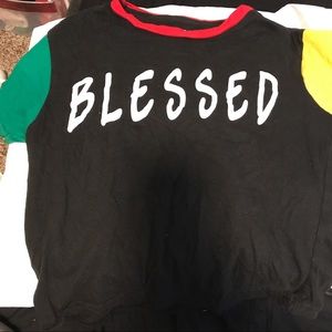 Black shirt with green and yellow sleeves